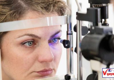 The doctor is examining the woman to determine if she is a suitable candidate for cataract surgery."