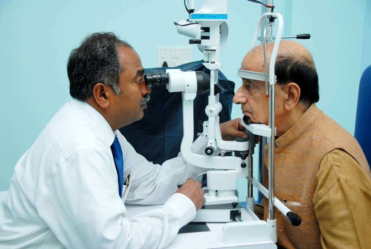 Dr. Appaji Gowda checking patient eyes