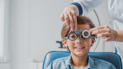 Little Boy Undergoing an Eye Exam By Pediatric Ophthalmologist