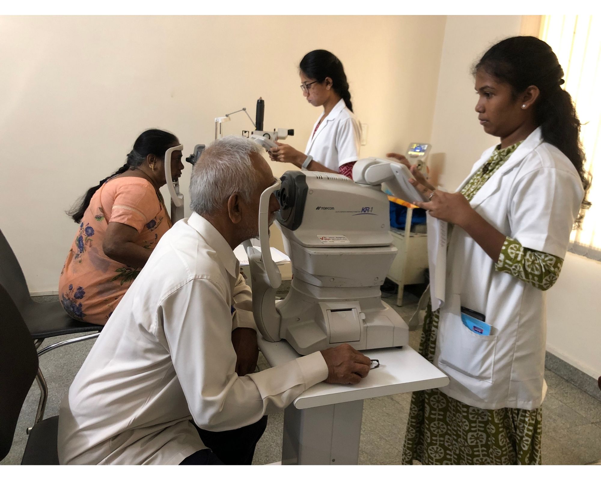 Student examining patient eyes